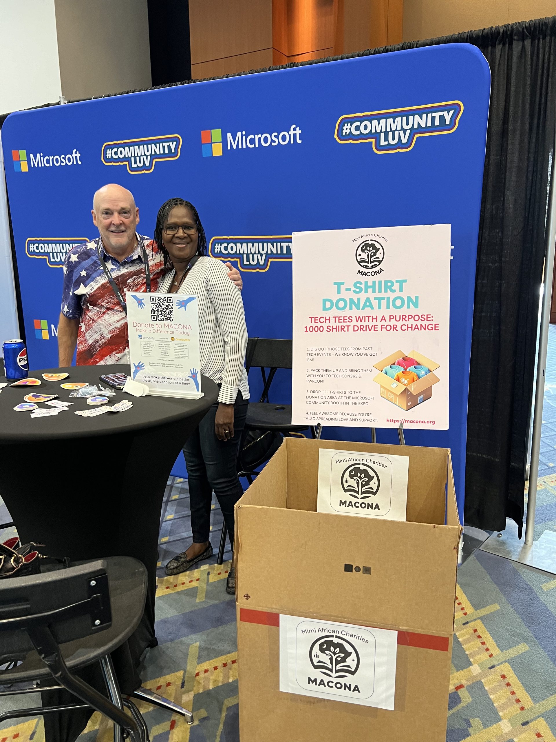Mimi Williams with a conference attendee at the Microsoft Community booth donation station