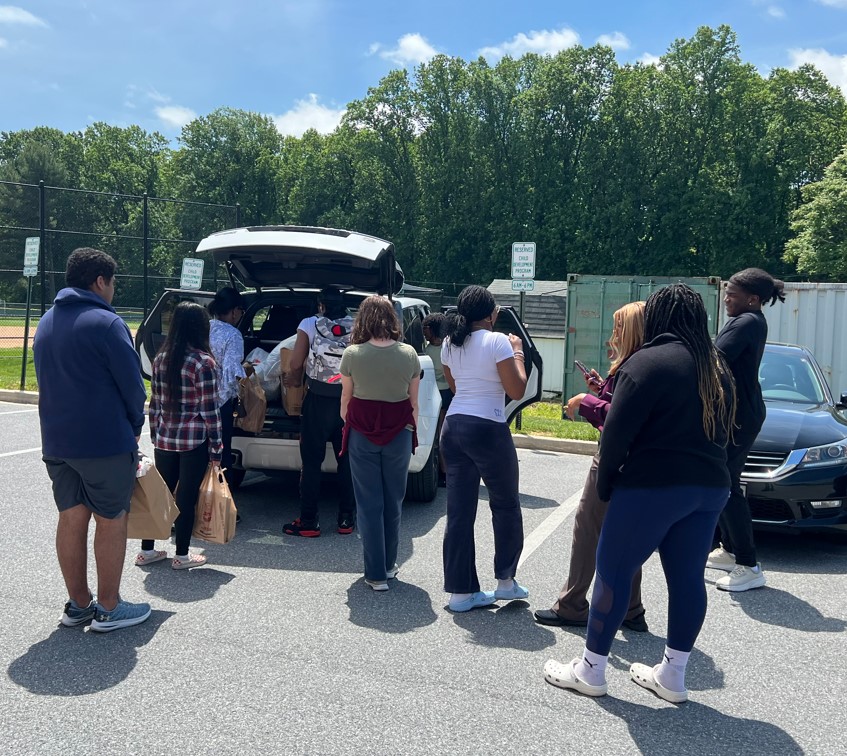 Atholton High School students sorting donated clothing and supplies