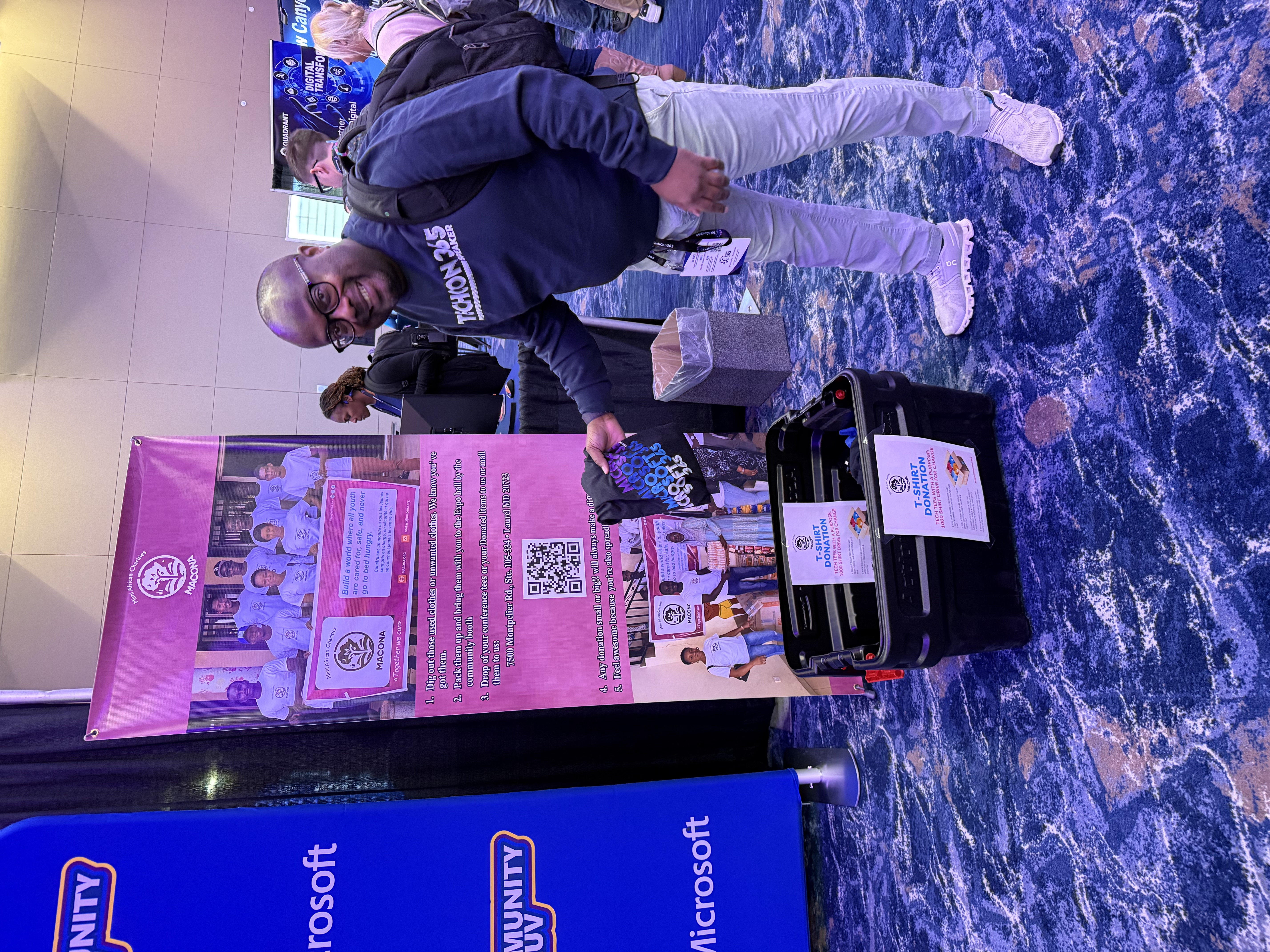 Fabian with the donation box at the booth